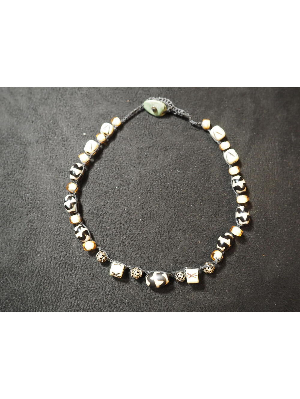 Handmade Black and White Patterned Bone Bead Necklace with Green Button Clasp